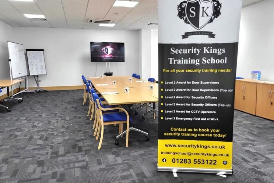 Security training room desk and poster